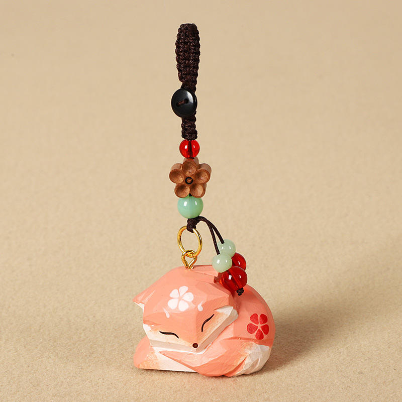 Sculpture sur bois renard-fleur de prunier pêche