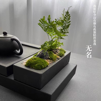 Plateaux à thé en pierre noire avec un design créatif de flux d'eau, style minimaliste moderne, utilisation domestique chinoise, table luxueuse, tapis à thé pour aquarium