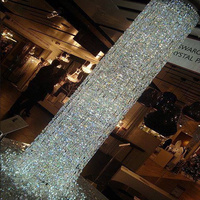 Lustre en cristal en cascade à colonnes rondes, luminaire suspendu vertical personnalisé pour hall d'hôtel, villa, plafond haut, escalier