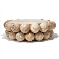 Table basse en travertin naturel, design perlé, table ronde en pierre artisanale sur mesure pour un espace de vie moderne