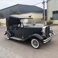 Voiture électrique vintage noire avec auvent, véhicule touristique antique longue portée pour hôtels, centres de villégiature et voyages de loisirs