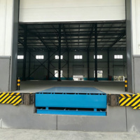 Niveleur de quai hydraulique fixe pour entrepôt, pont de chargement et déchargement pour terminal de fret