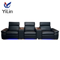Fauteuil inclinable électrique noir en microfibre pour salon, style moderne, avec fonction massage et extension, idéal pour home cinéma