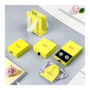 Caja de embalaje de Joya de joyería deslizante con cajón de papel de cartón de color amarillo de lujo directo de fábrica con bolsa para joyería