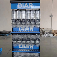 Présentoir vertical en métal personnalisé avec logo imprimé pour noix, idéal pour l'aménagement de supermarchés du Moyen-Orient