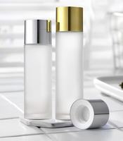 Flacon en verre rond transparent givré pour sérum et hydratant capillaire avec pompe pulvérisatrice et impression sérigraphique, emballage cosmétique