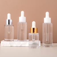 Flacon compte-gouttes en forme de cylindre de luxe transparent portable de haute qualité personnalisé avec pipette en verre Vente en gros