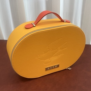 Boîte cadeau ovale en cuir PU jaune, étui de rangement portable à motif <span class=keywords><strong>hirondelle</strong></span> en relief, valise <span class=keywords><strong>d</strong></span>'emballage <span class=keywords><strong>nid</strong></span> <span class=keywords><strong>d</strong></span>'oiseau avec poignée - Product Image 1