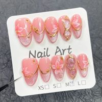 Faux ongles press-on en amande moyenne faits à la main, motif floral 3D et imprimé léopard, décorations cloutées en métal, réutilisables