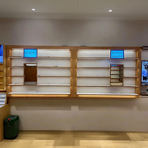 Magasin de vente au détail optique contemporain avec étagères ouvertes à niveaux et vitrines rondes éclairées - Product Image 6