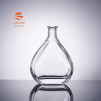 Bouteille de vin en verre en forme de goutte d'eau de 700 ml, logo personnalisable disponible pour les marques de brandy, de vin de fruits et de spiritueux