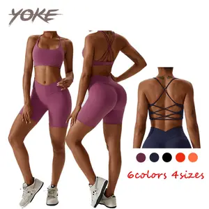 Yoke ropa de mujer OEM precio competitivo cruzado Sujetador deportivo Mujer alto rendimiento a prueba de golpes acolchado yoga Sujetador deportivo