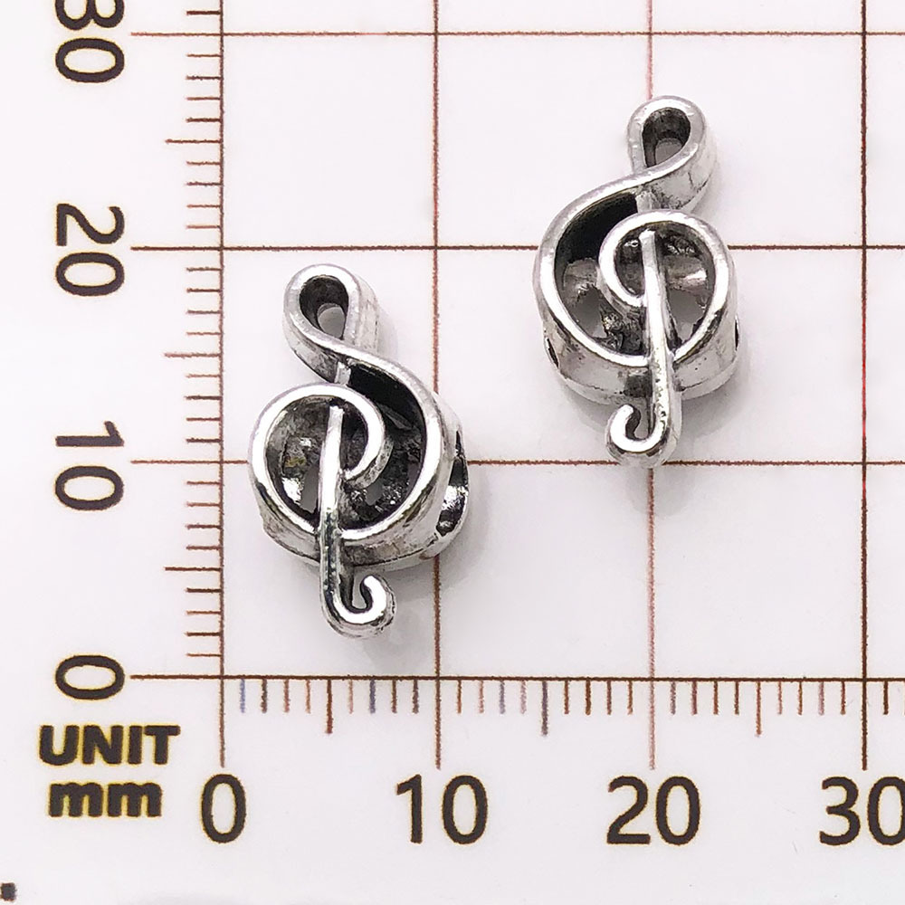 Une note de musique antique en argent - 1,3g - 8*18mm - 5985