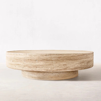 Table basse ronde en travertin sculpté Vitolo, mobilier en pierre moderne de luxe pour le salon
