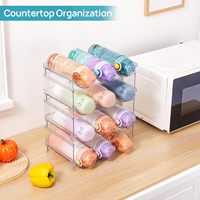 Lot de 4 supports empilables pour bouteilles d'eau en plastique transparent pour le rangement des tasses dans le garde-manger des armoires de cuisine.