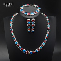 Ensemble de collier, bracelet et boucles d'oreilles en zircon rouge et bleu de luxe pour femmes, bijoux élégants en cristal pour mariage, soirée, robe de soirée