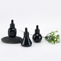 Flacon compte-gouttes en verre opale noir brillant de 30 ml, emballage cosmétique premium pour sérum, idéal pour les marques de produits de beauté et de soins de la peau.