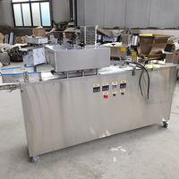 Machine à diviser et à arrondir la pâte pour un travail continu, machine à couper et à arrondir la pâte pour boulangerie