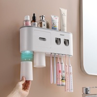 Presse-dentifrice électrique mural Porte-brosse à dents sans poinçon avec rince-bouche en plastique durable Fabricant direct