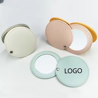 Miroir de maquillage compact rond en cuir PU rotatif avec logo personnalisé, idéal pour les cadeaux, vente en gros