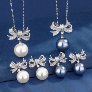Wholesale Fashion Eco-friendly Copper 14-12mm White Shell Pearl Bow Design Anti Tarnish <b>Earring</b> Necklace <b>Set</b> for Women - Product Image 1