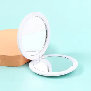Mini espelho cosmético portátil creme plástico Flip frente e verso pequeno espelho redondo MAKEUP espelho dobrável portátil