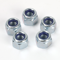 Écrou de blocage hexagonal épais en acier au carbone DIN 982 Grade 8 avec insert non métallique, zingué bleu-blanc, pour applications anti-vibrations