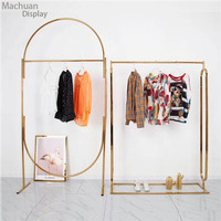 Étagère de présentation de vêtements pour magasin de vêtements pour femmes en or, étagères de magasin de vêtements en or pour robes