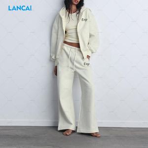 Sudadera con capucha y cremallera completa en blanco de rizo de algodón para mujer de alta calidad personalizada y pantalones de chándal holgados a juego Beige conjunto de 2 piezas para mujer - Product Image 1