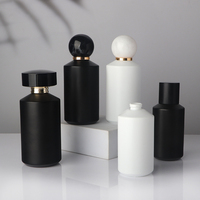 Flacons de parfum vides cylindriques noirs et blancs de luxe 50 ml 100 ml avec pulvérisateur à pompe rechargeable pour huiles essentielles et parfums