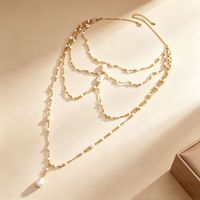 Collier long superposé en perles fines, luxe léger, élégance délicate, accessoire polyvalent
