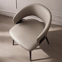 Chaise de salle à manger rembourrée de style italien minimaliste, luxe léger, nordique moderne, avec accoudoirs en acier et mousse haute élasticité pour restaurant
