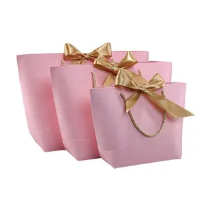 리본 손잡이를 가진 분홍색 호화스러운 부티크 종이 쇼핑 백 주문 인쇄 로고 우아한 백색 까만 작은 활 선물 종이 봉지