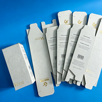 Boîte d'emballage personnalisée pour soins de la peau en carton blanc gaufré avec impression et dorure à chaud