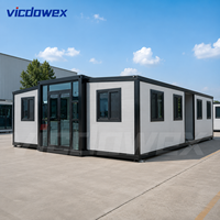 VICDOWEX Maison conteneur extensible à double aile avec 2 chambres, salle de bain et cuisine pour hébergement et bureau