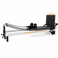 Reformer de Pilates commercial portable en alliage d'aluminium avec système de rétraction automatique des cordes réglable pour usage en studio