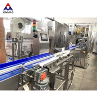Machine d'étiquetage automatique de manchons rétractables en PVC XINMAO pour les étiquettes en plastique