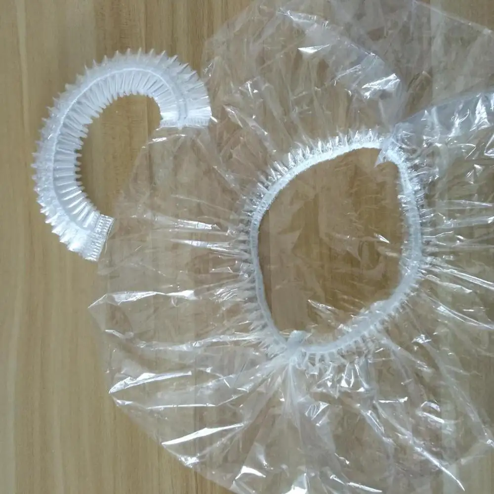 डिस्पोजेबल निविड़ अंधकार प्लास्टिक पीई शावर बाथ कैप पारदर्शी स्पष्ट होटल बाथरूम सफेद पट्टी क्लिप सिर को कवर