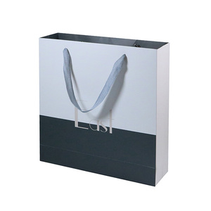 Nuevo diseño elegante de gran tamaño de cinta mango blanco bolsa de papel de embalaje para tienda de ropa - Product Image 4
