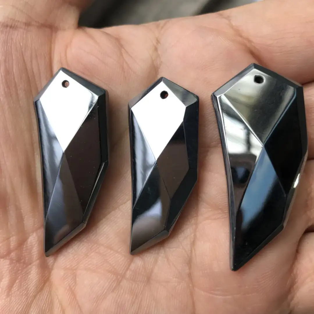 faceted terahertz wolf tooth pendant