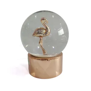 Golden bird snow globe custom made for home decor