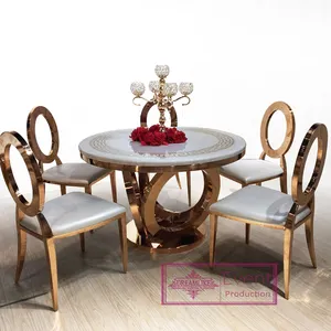 दौर संगमरमर शीर्ष गुलाब गोल्ड धातु आधार 6 स्टेनलेस स्टील कुर्सियों के साथ खाने की मेज सेट