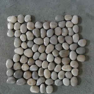 Sliced white cut river polished pebble tile stone floor and bath mat