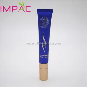 Dark blue soft cosmetic packaging tube with gold top cap for eye serum