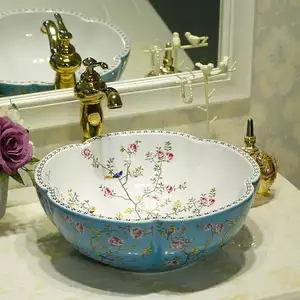 Porcellana Bagno contatore top lavabo in ceramica bacino di arte fatto a mano blu con fiore bianco e il modello di uccello lavandino del bagno