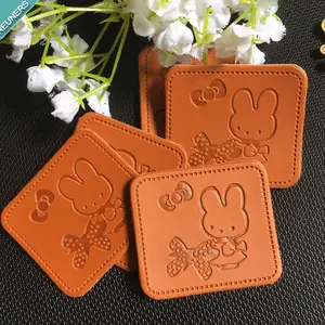 Customized high quality emboss pu leather label pu leather tags woven patch logo leather for jeans