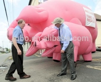 Grand cochon rose gonflable, cochon publicitaire de dessin animé