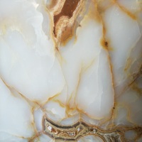 Prix des dalles de marbre onyx blanc naturel très demandées pour la conception de projets de luxe