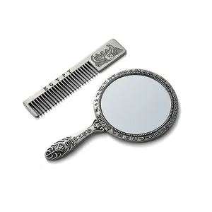 Miroir cadeau de haute qualité avec peigne en alliage de zinc tenu dans la main miroir et peigne de style égyptien