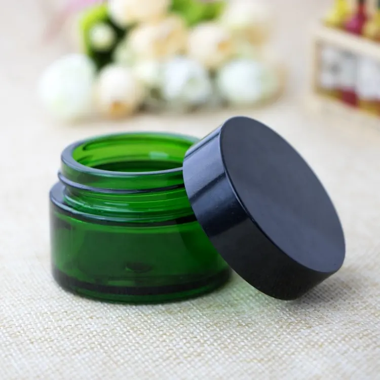 High quality small cosmetic cream round green 30ml 1 oz glass jar with black golden silver aluminum screw top lid